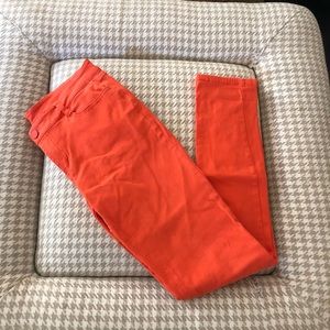 Orange stretch jeans. Size medium.